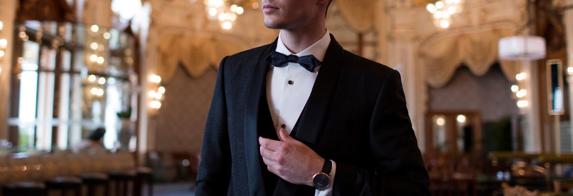 Groom in a black dinner suit and bow tie