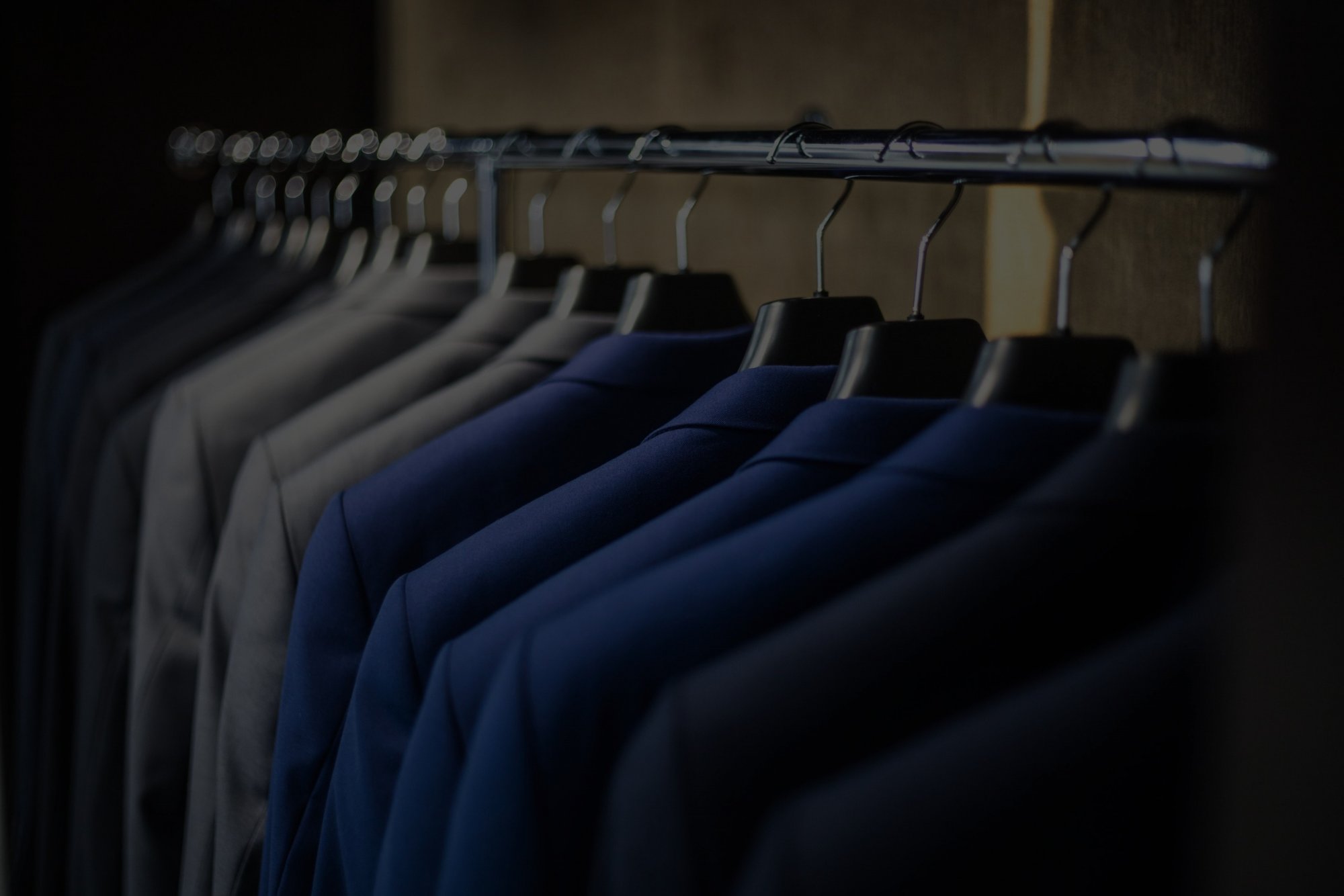 Suits on a rail in the Larry Adams shop